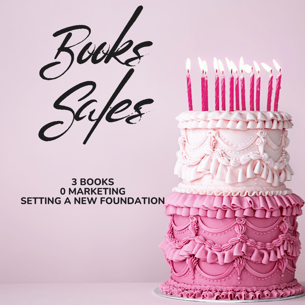 A two-tiered pink and cream cake with pink lit candles on top